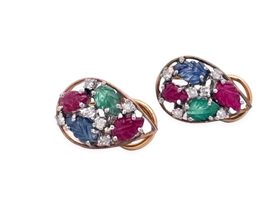 Colorful carved gemstone set with diamonds