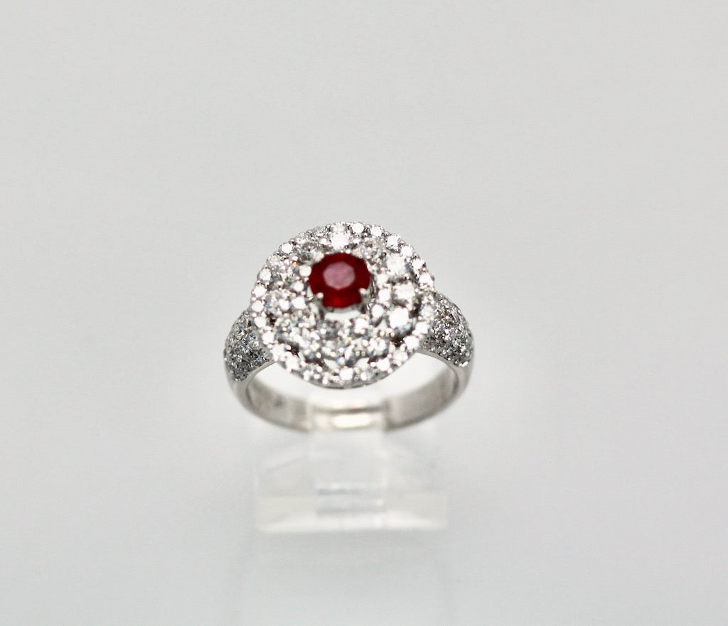 Silver ring with a red gemstone 