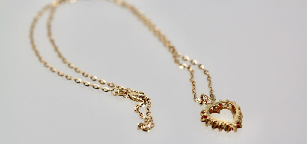 Diamond ruby heart on gold