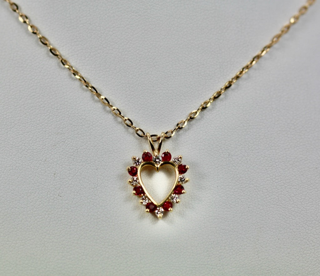 Ruby heart pendant with diamonds

