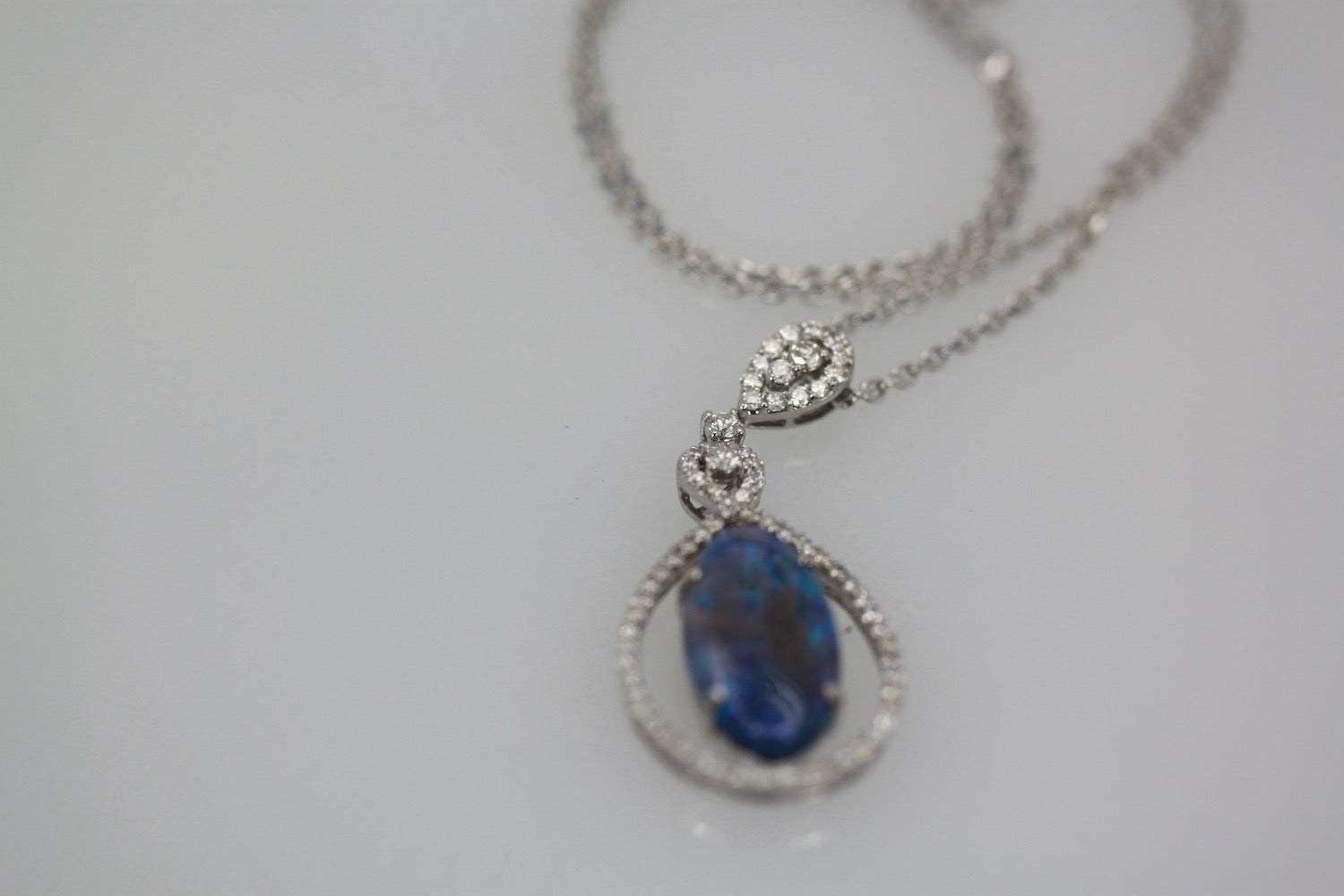 Black opal and diamond pendant

