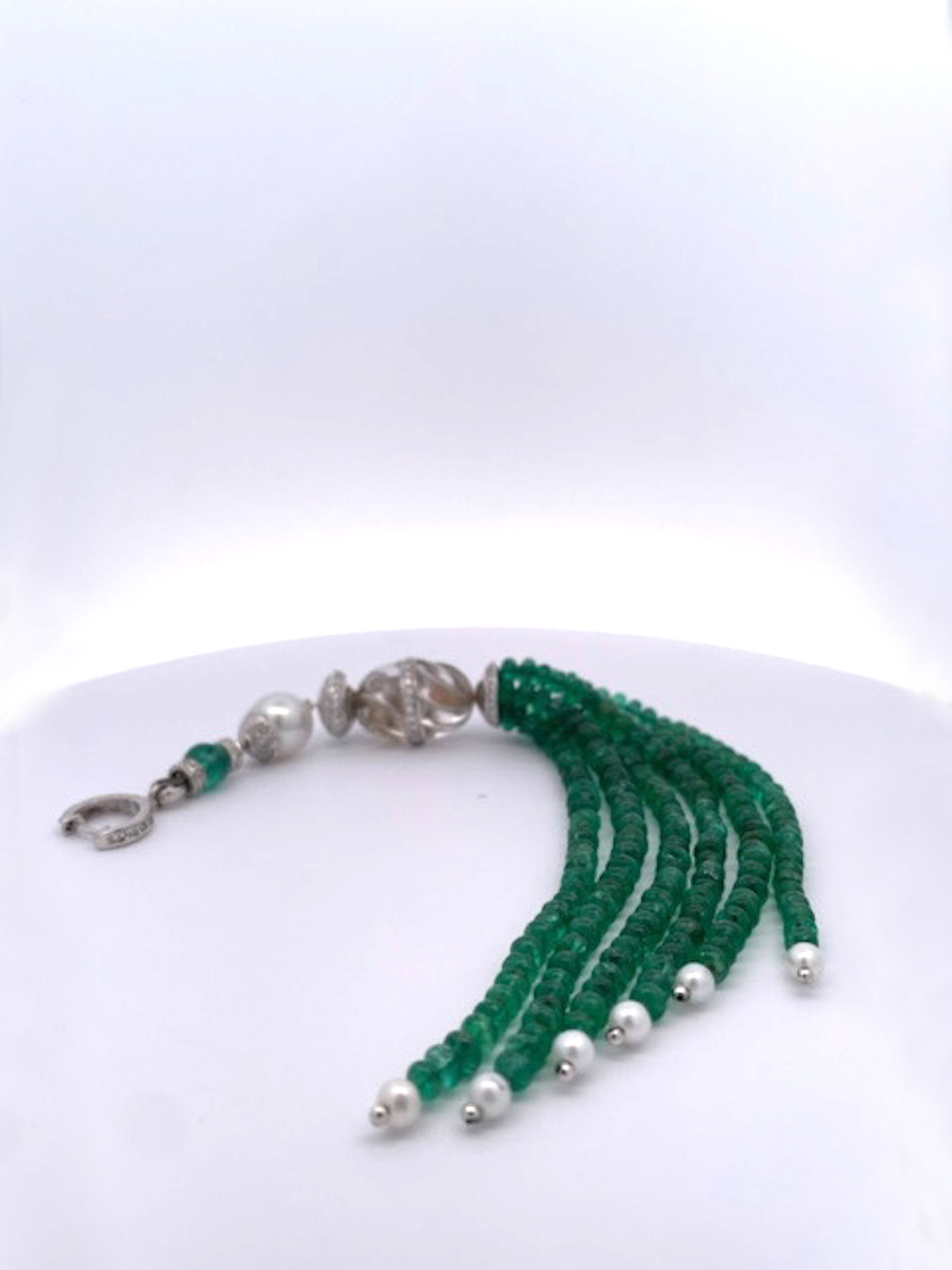 Rock crystal tassel enhancer with Emerald strands