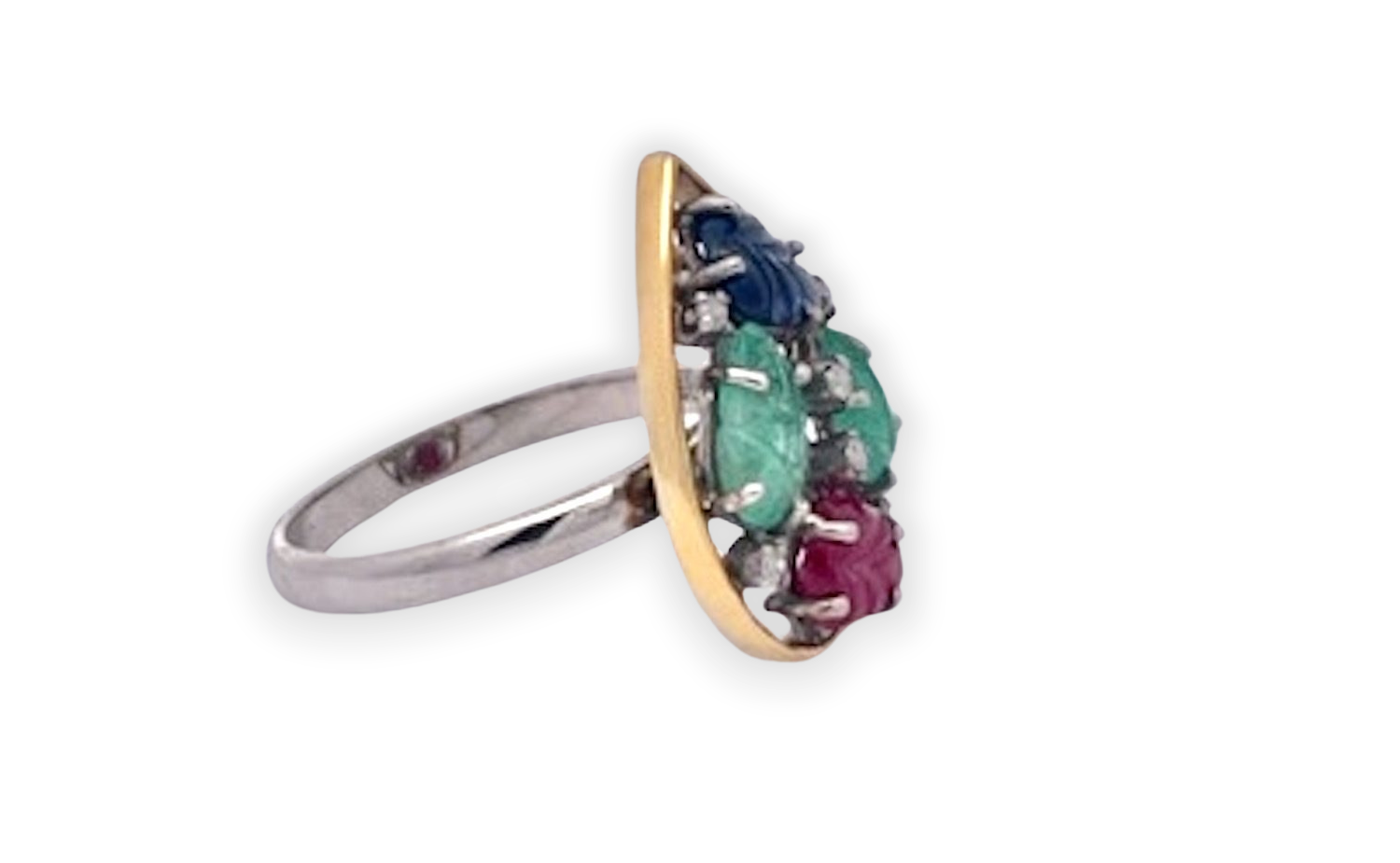 Colorful carved gemstone set with diamonds