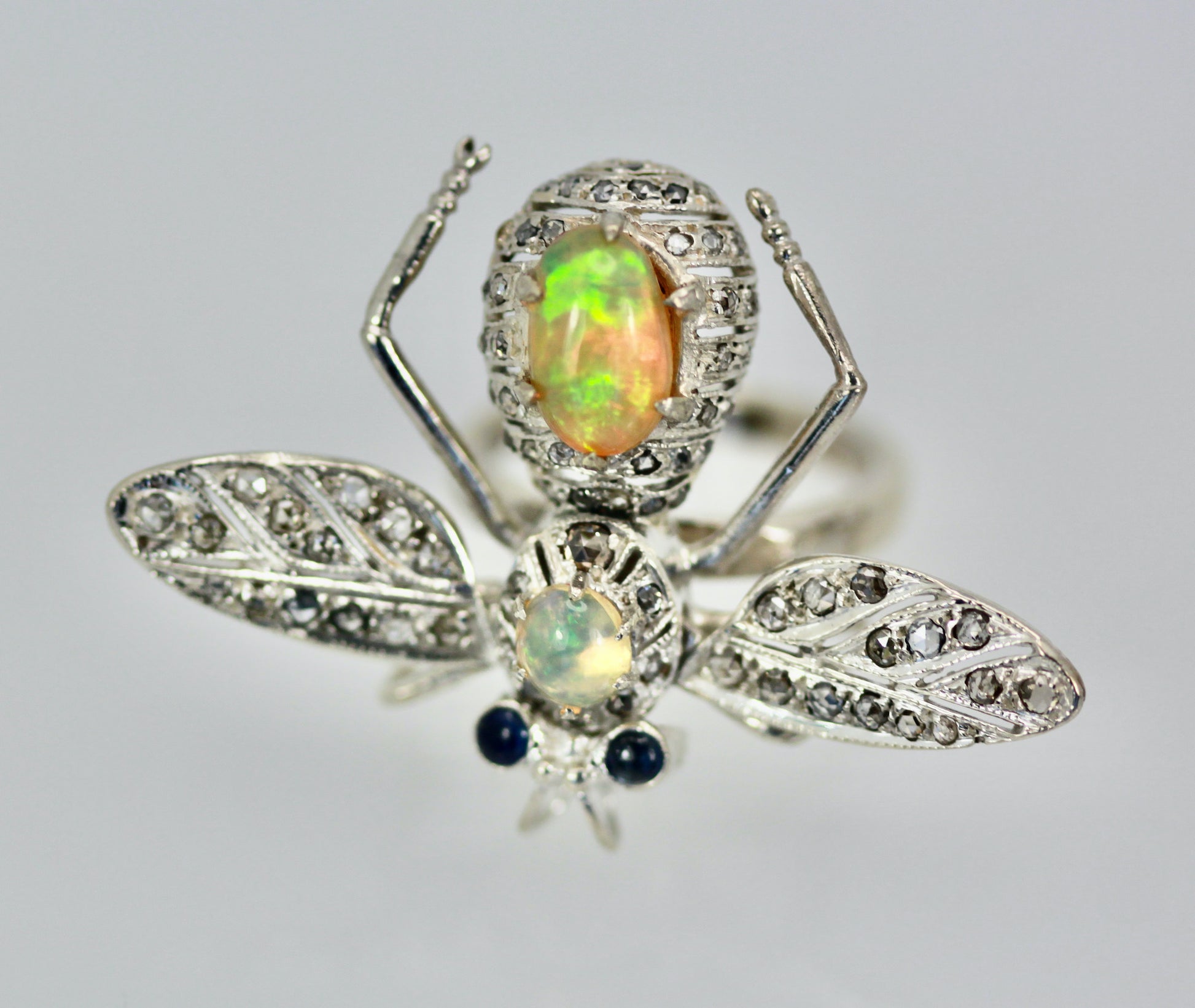 Butterfly brooch with opal, 14K