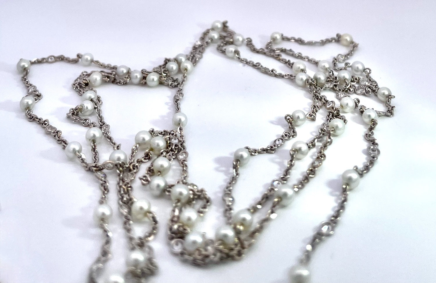 Pearl and diamond necklace, 52"