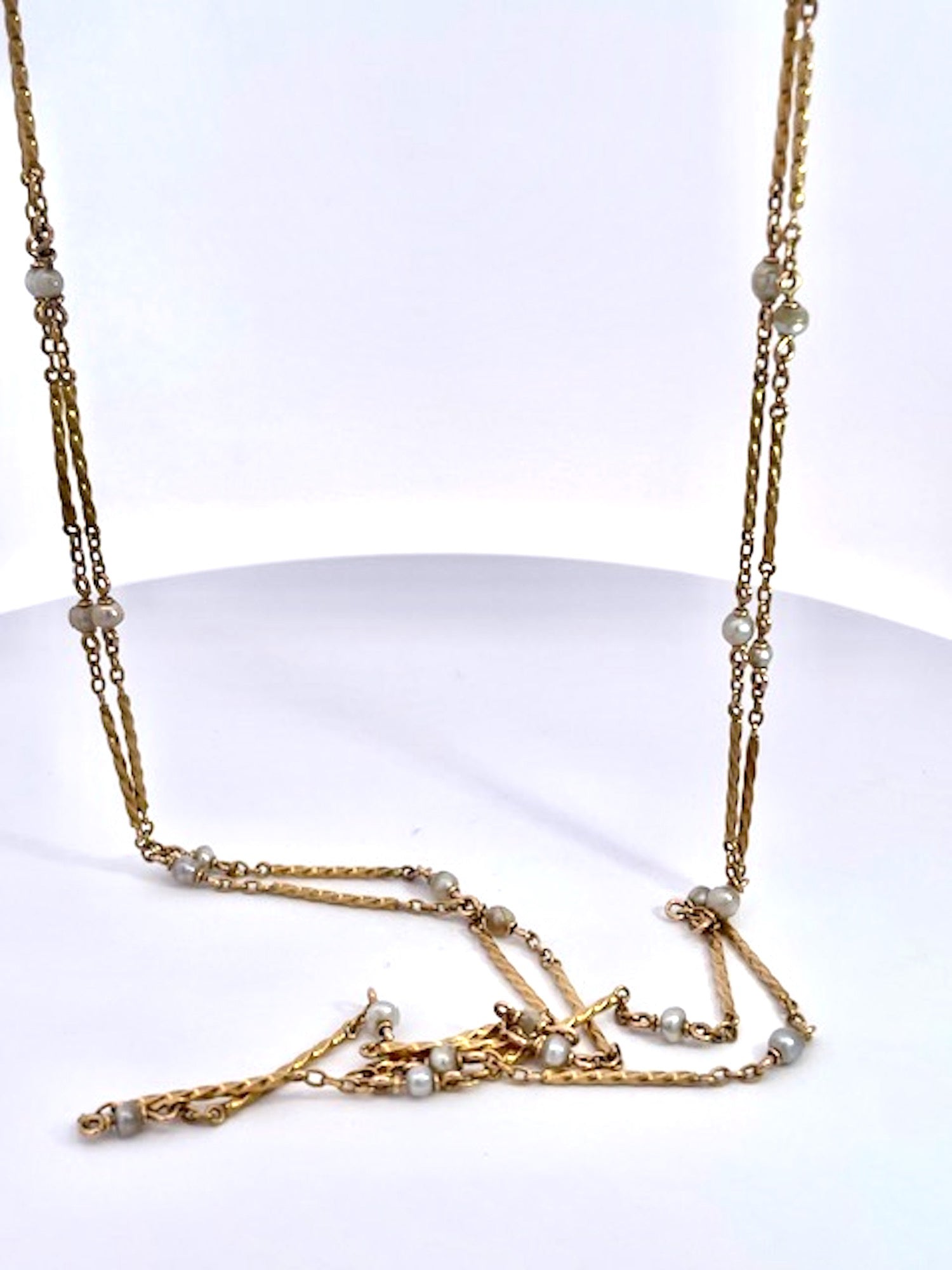 Gold chain necklace with small pearls 