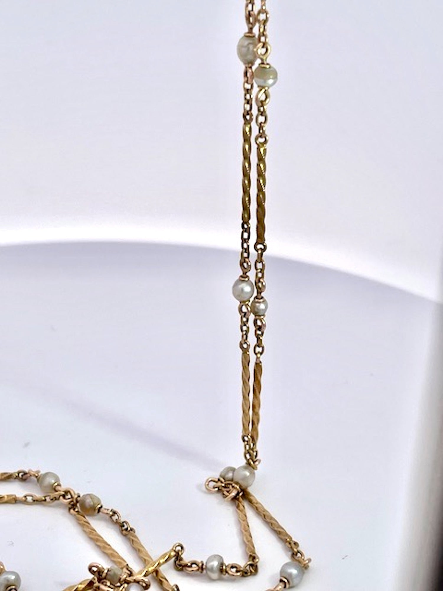 Gold chain necklace with small pearls 