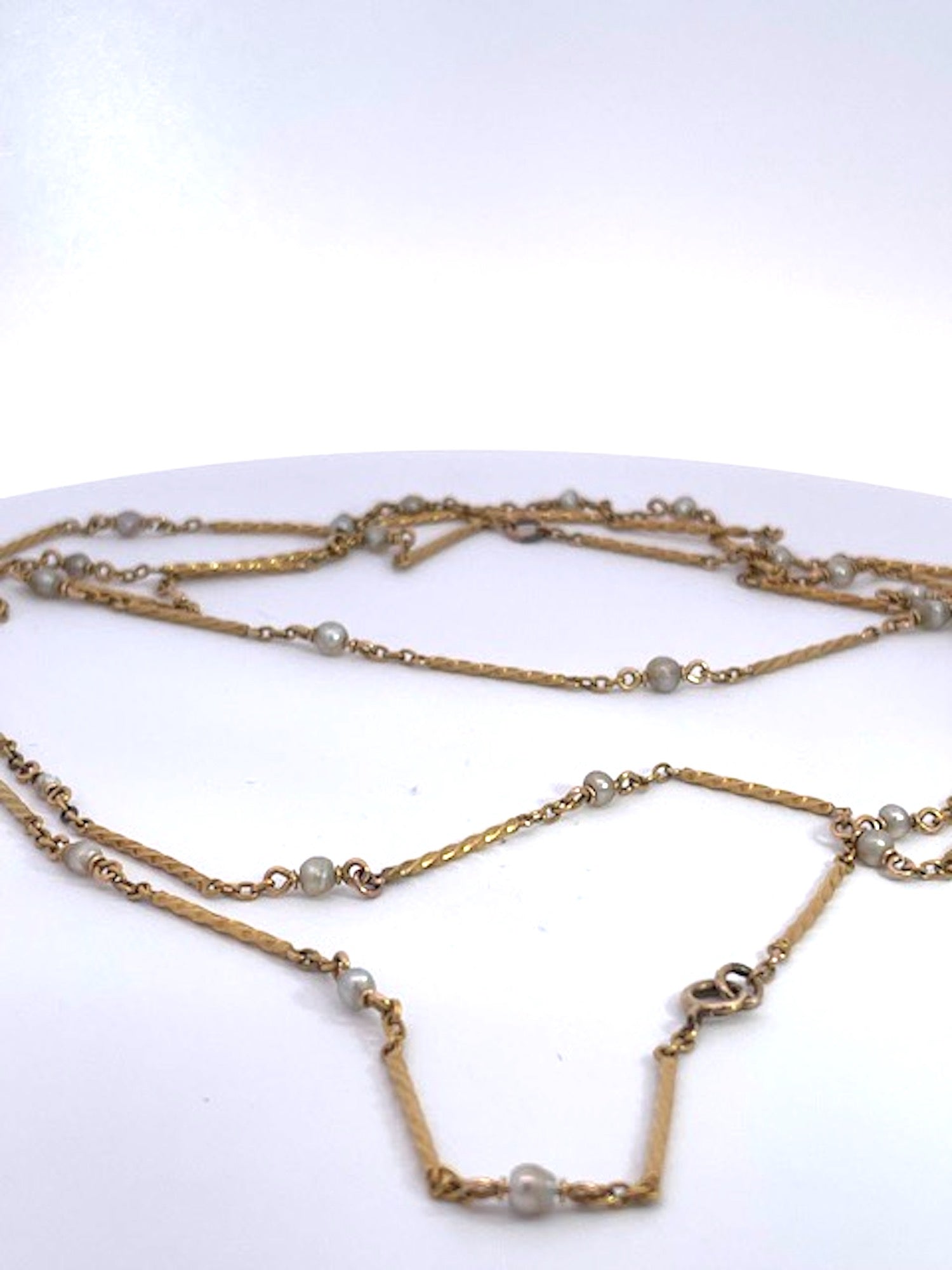 Gold chain necklace with small pearls 