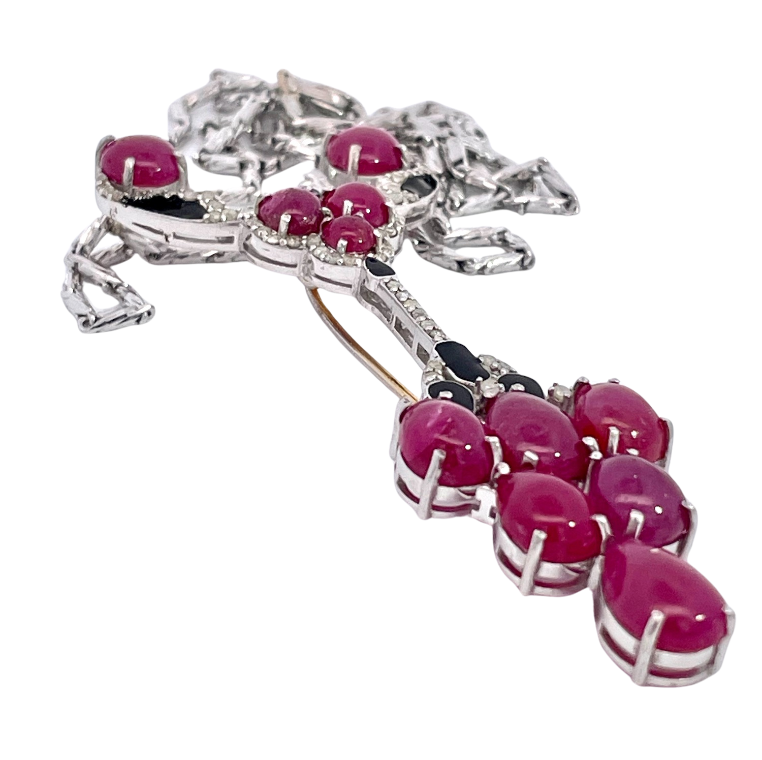 Gold ruby brooch with onyx