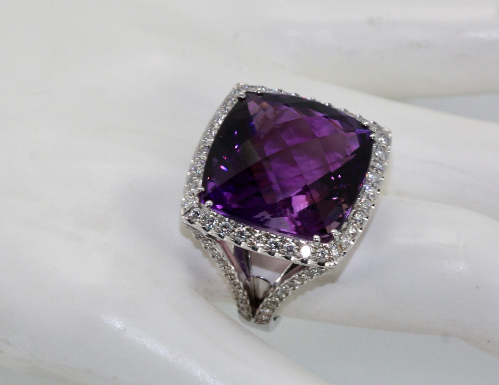 Amethyst ring with diamond halo