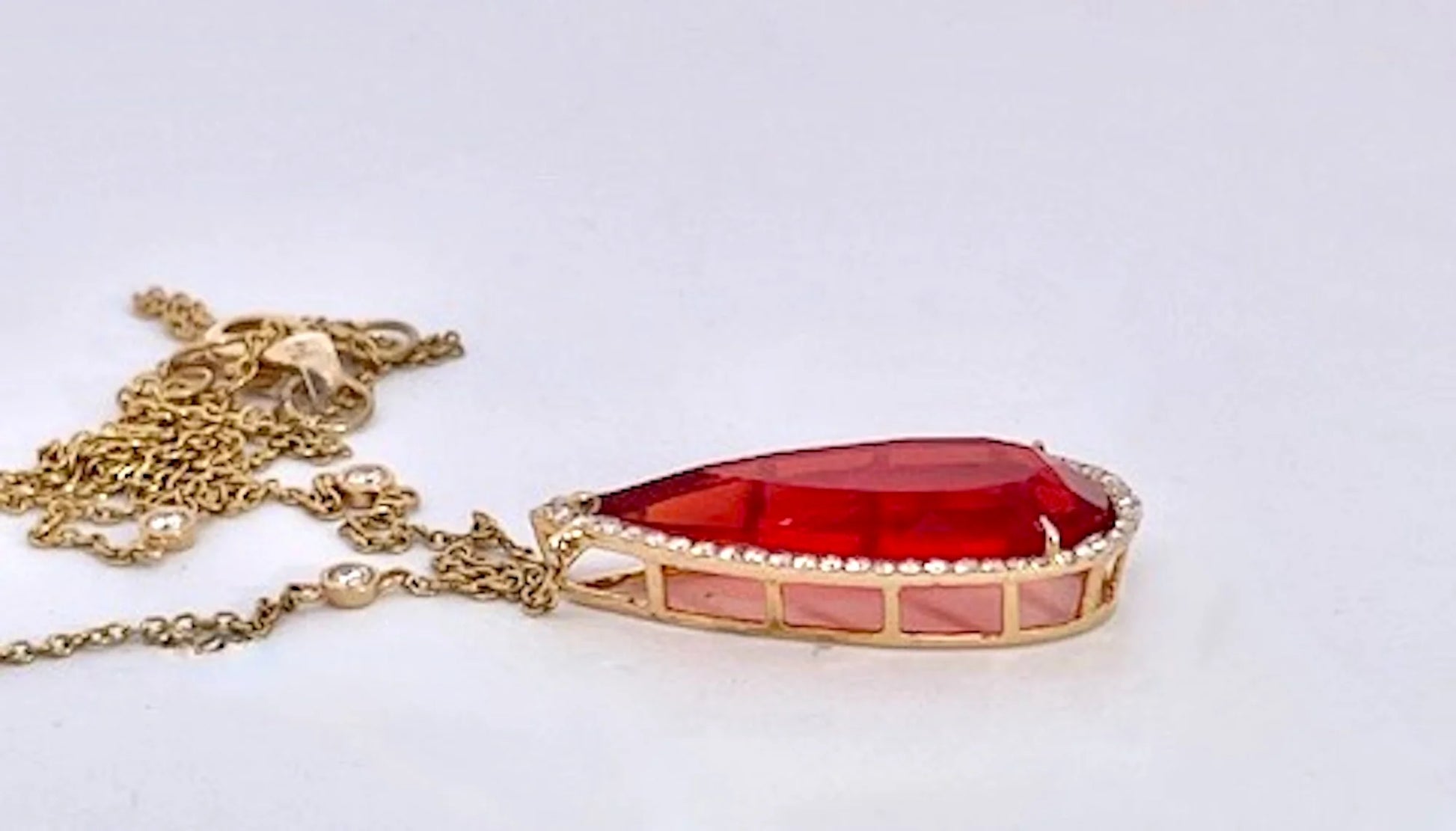 Fire Opal with Diamond surround 18K