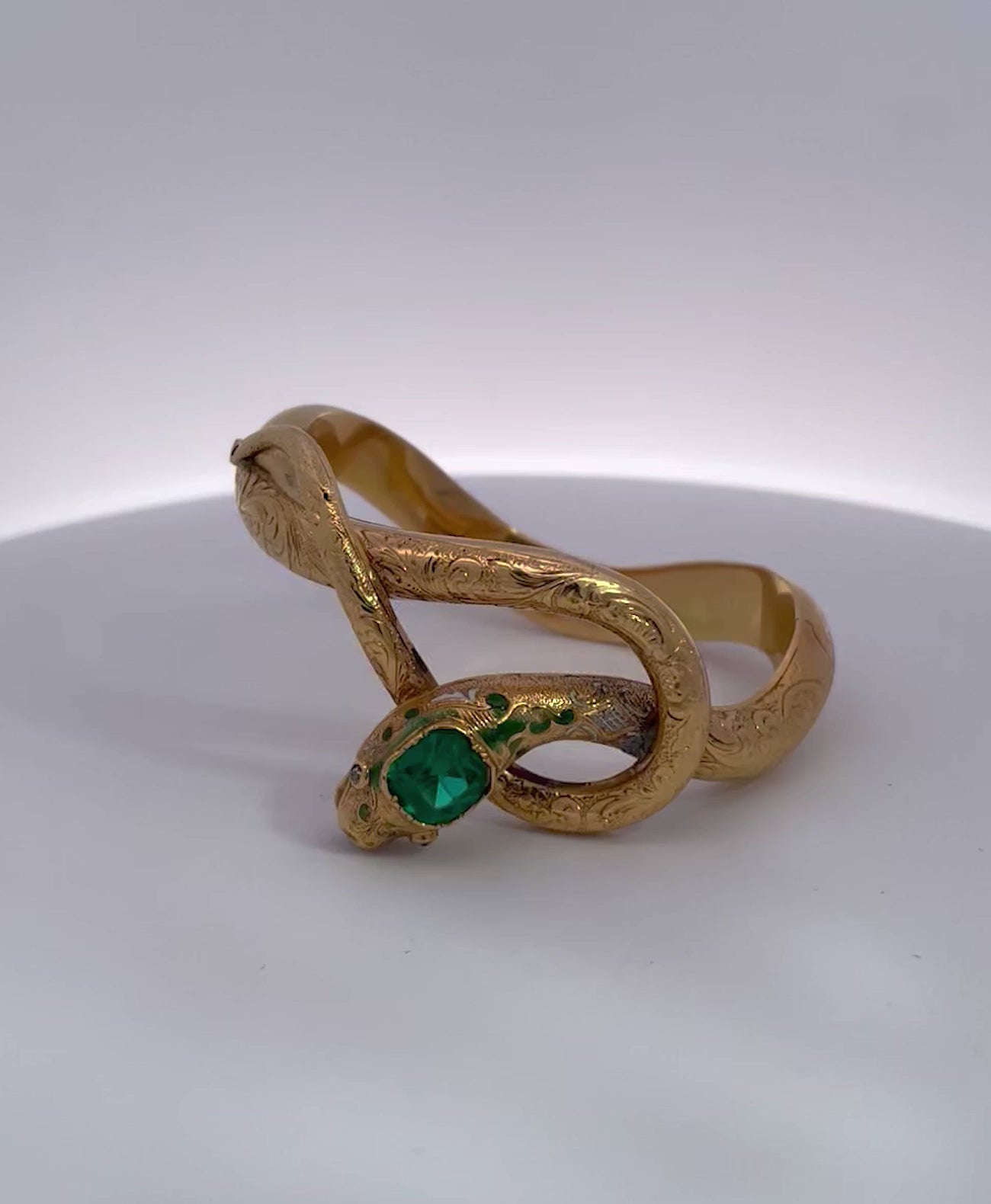 Snake bracelet with emerald, 14K