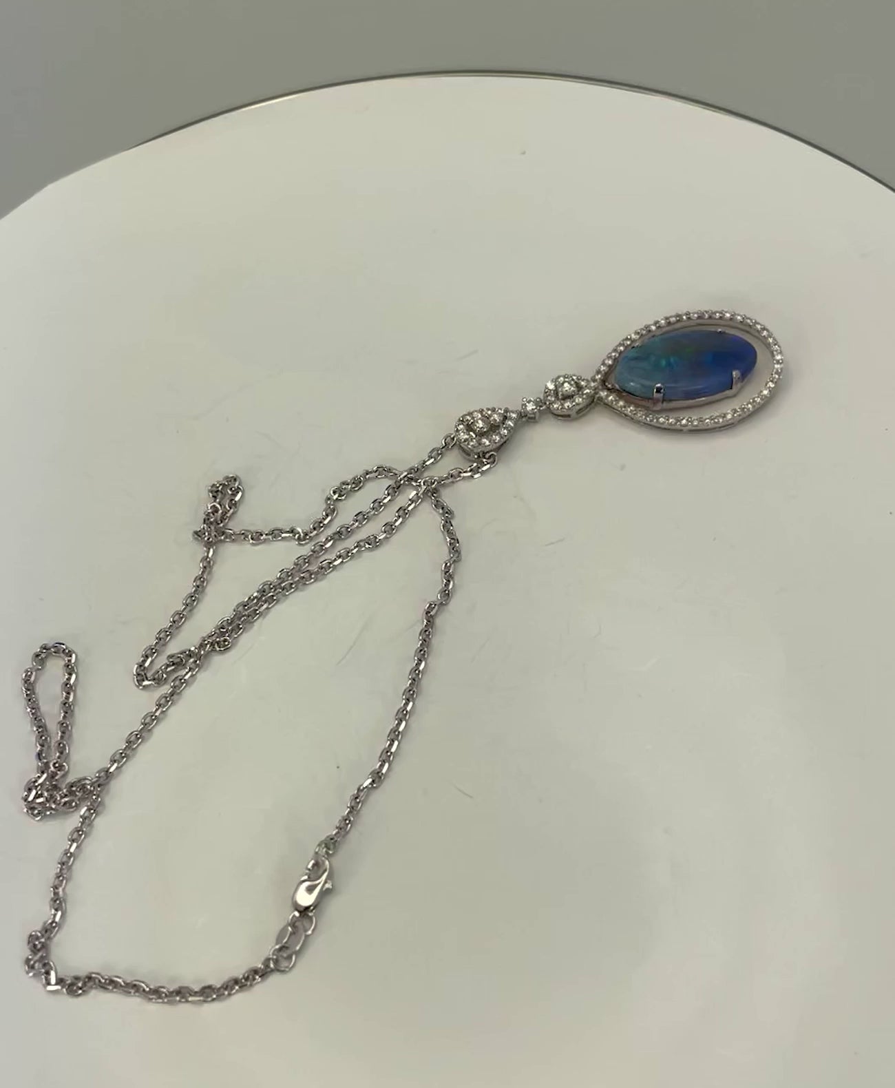 Crystal opal with diamond surround