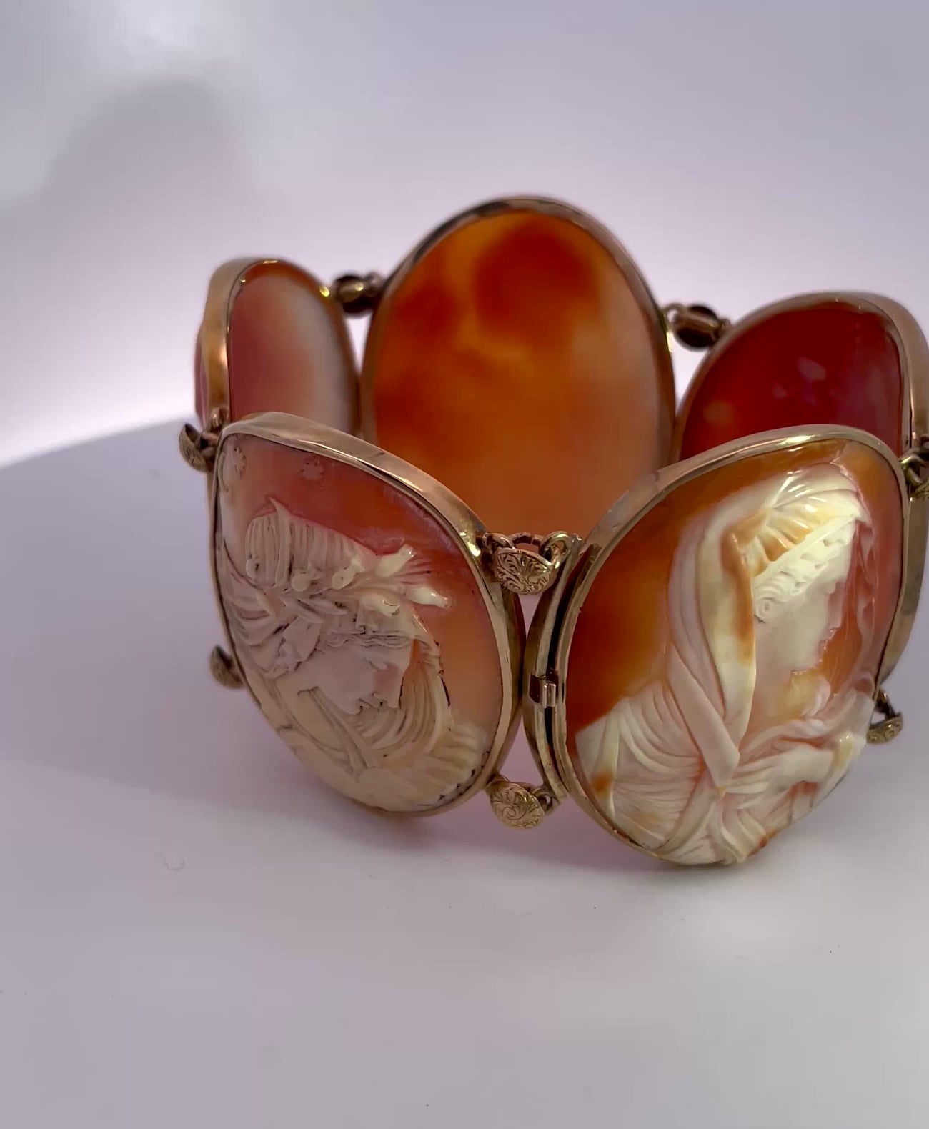 Gold link bracelet with carved cameos