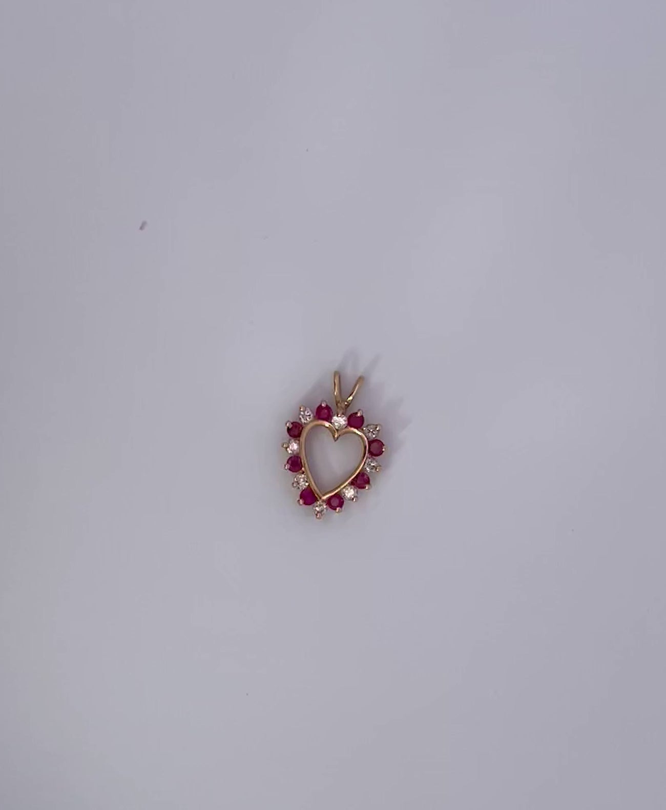 Ruby heart pendant with diamonds