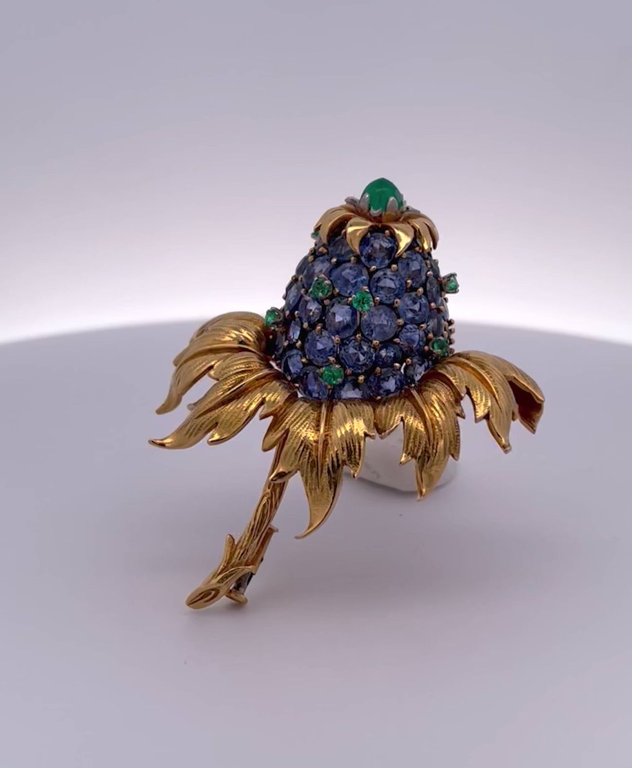 Blue sapphire and emerald thistle brooch in 18K gold