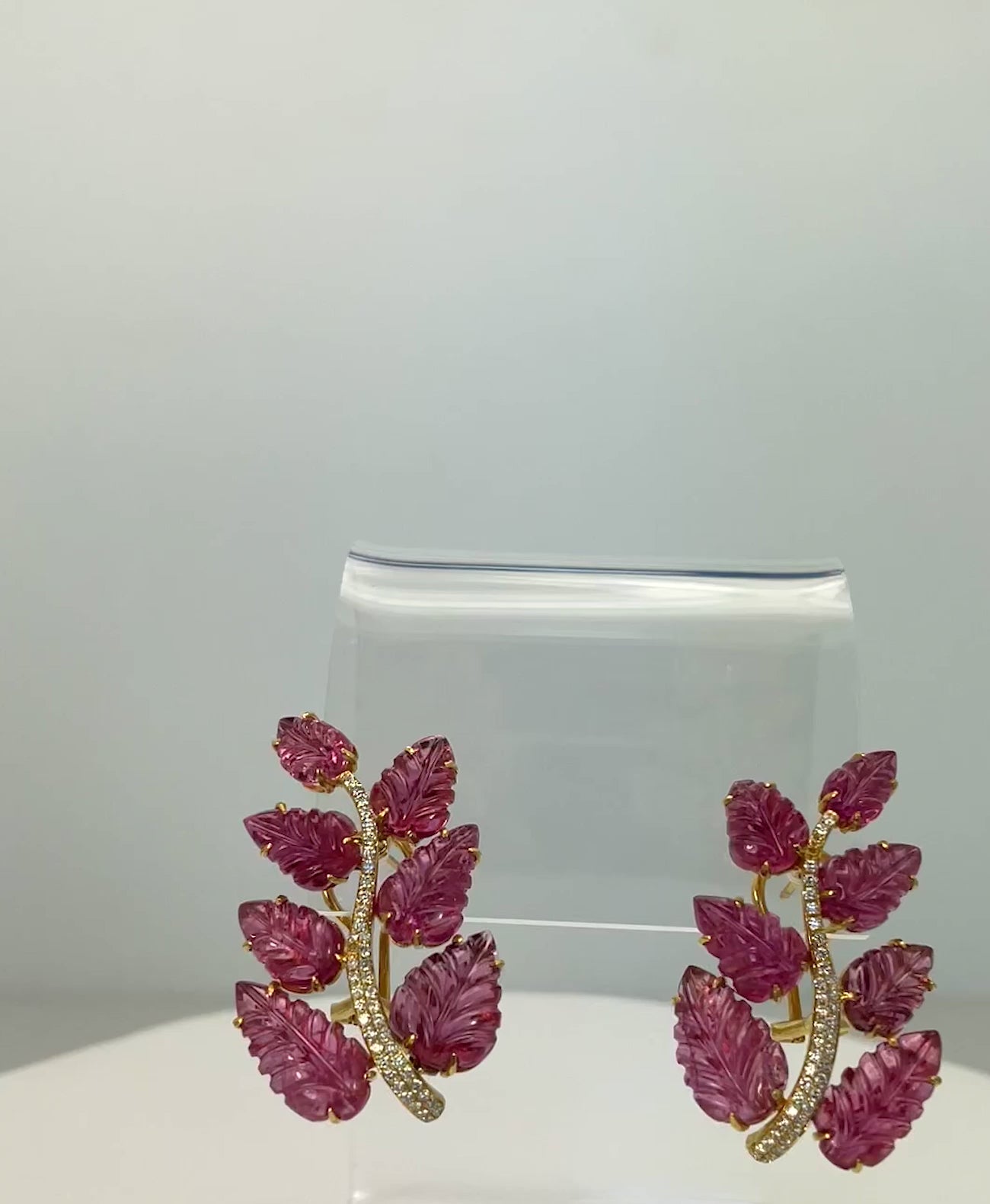Gold earrings with rubellite leaves