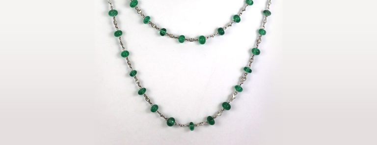 Gold and Emerald: Exploring the Rich History of Antique Emerald Necklaces