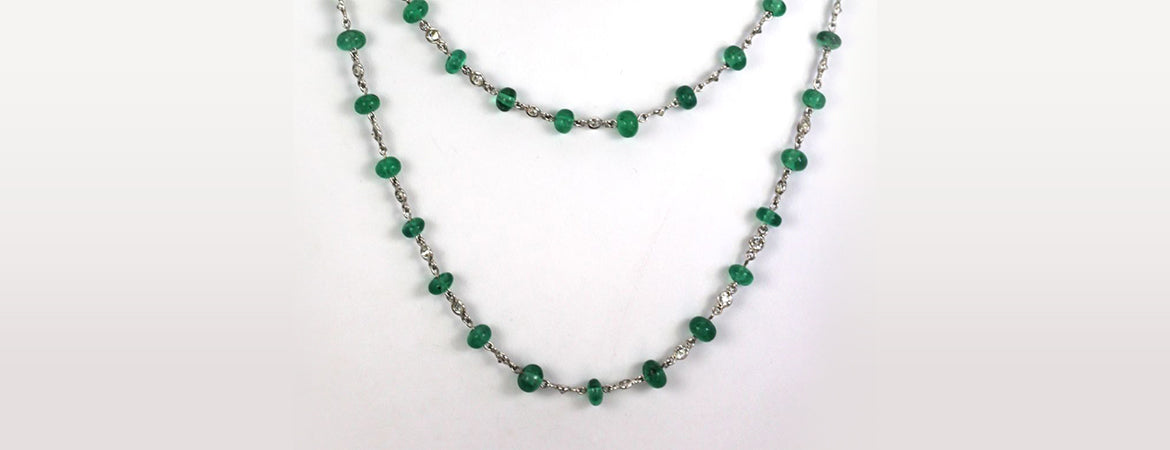Gold and Emerald: Exploring the Rich History of Antique Emerald Necklaces