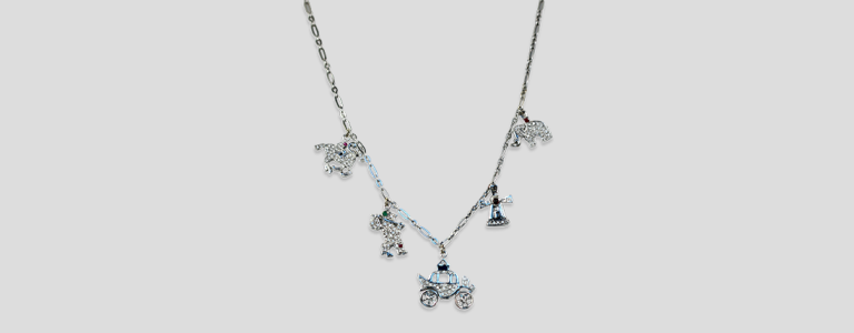 A Modern Classic Reimagined with Contemporary Elegance: The Deco Platinum Charm Necklace