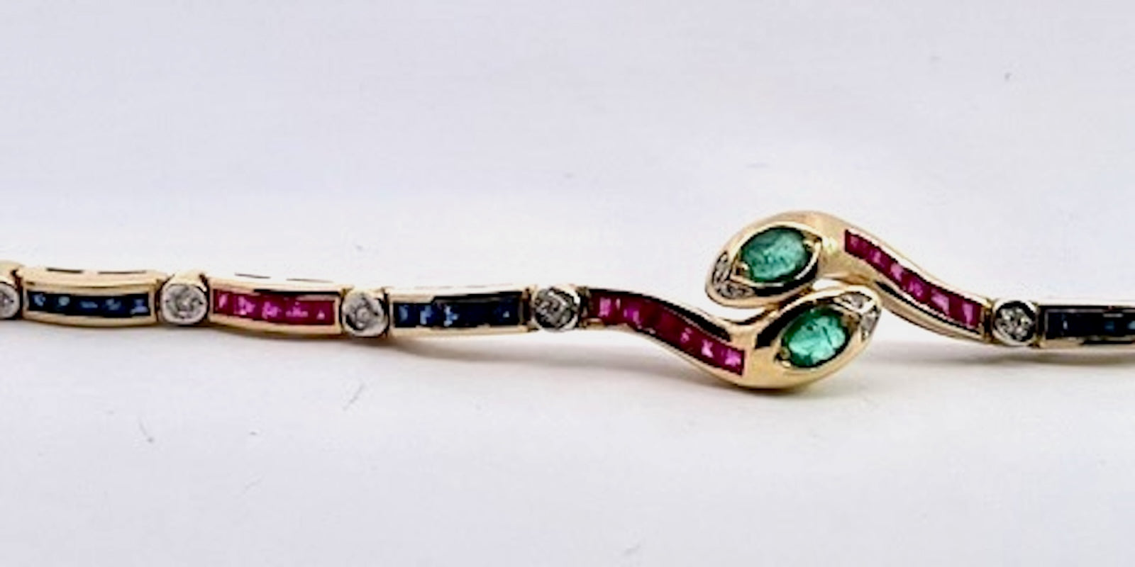 Vintage Yellow Gold Snake Bracelet with Emeralds, Rubies, and Diamonds - Detail View 1 | Cris Notti Jewels